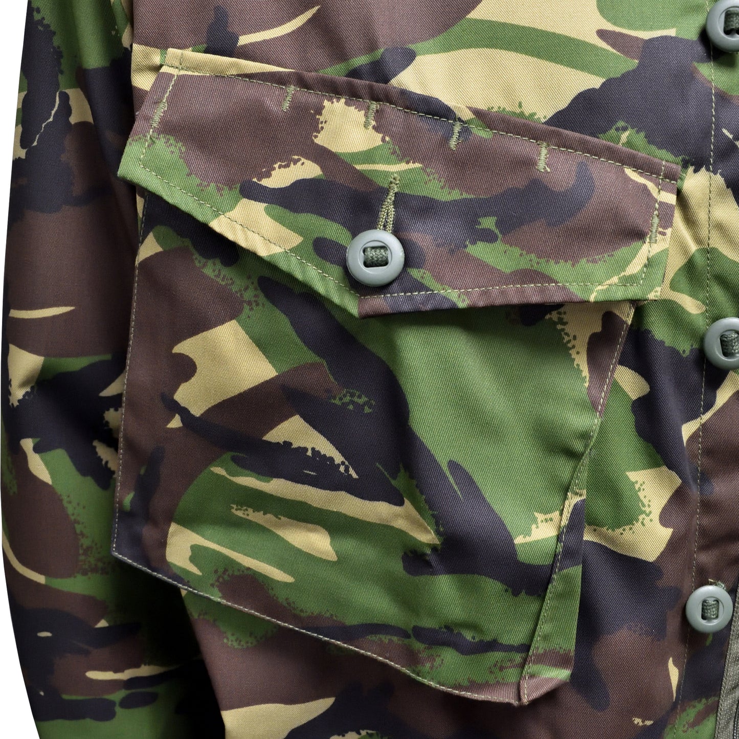 Detail shot of chest pocket and camouflage print on Lightweight Combat Jacket DPM.
