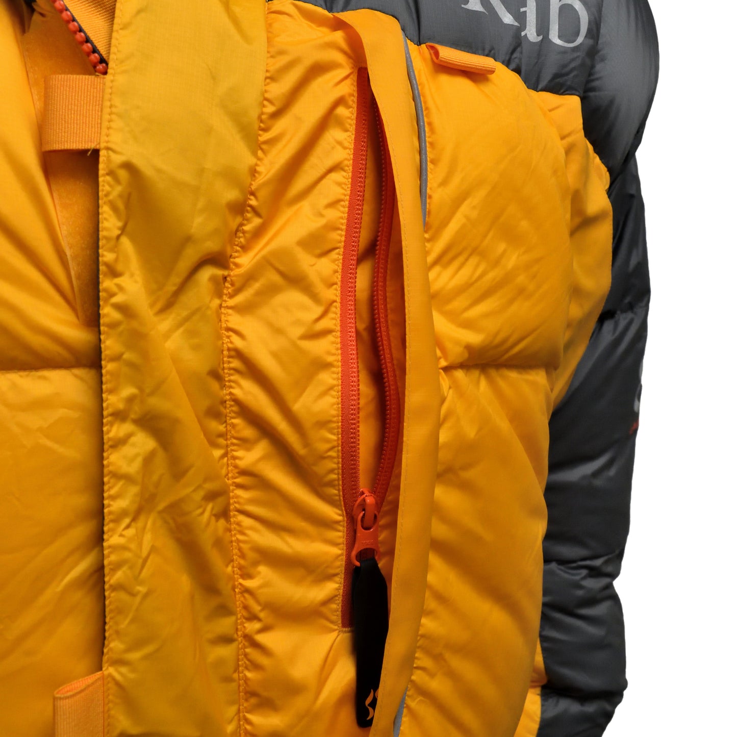 Close-up of zipper and pocket flap on RAB Expedition 8000 Jacket.