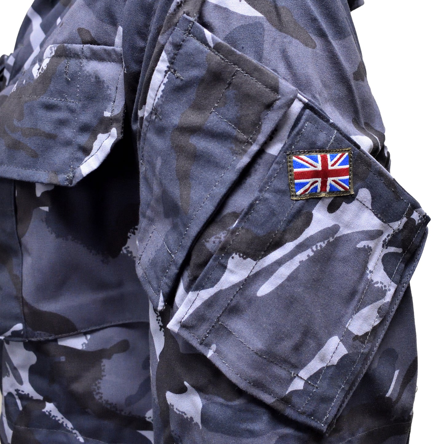 Close-up of Union Jack flag patch on sleeve of British Army Windproof Combat Smock Blue Camo.