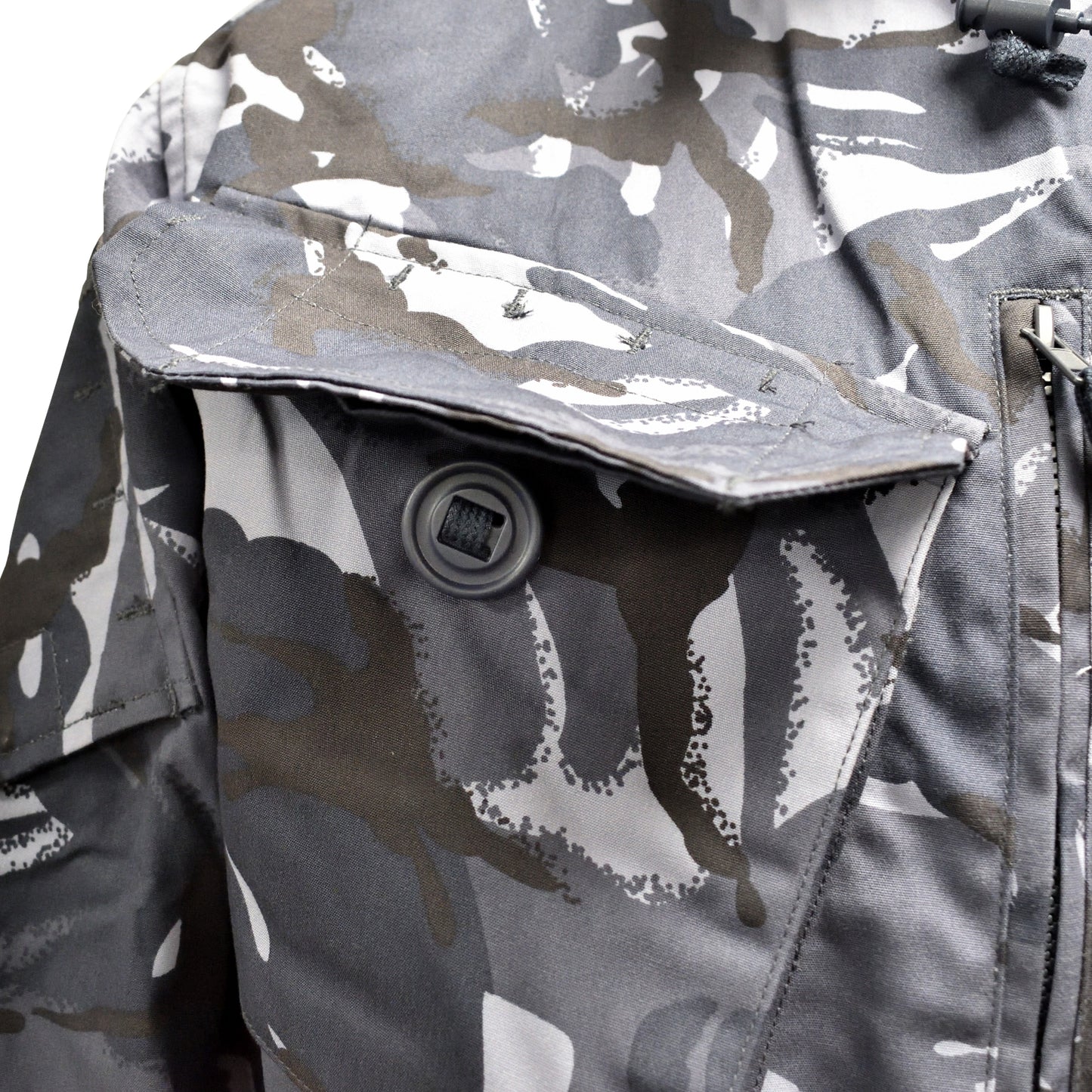 Macro image of blue camo fabric and stitching on British Army Windproof Combat Smock.