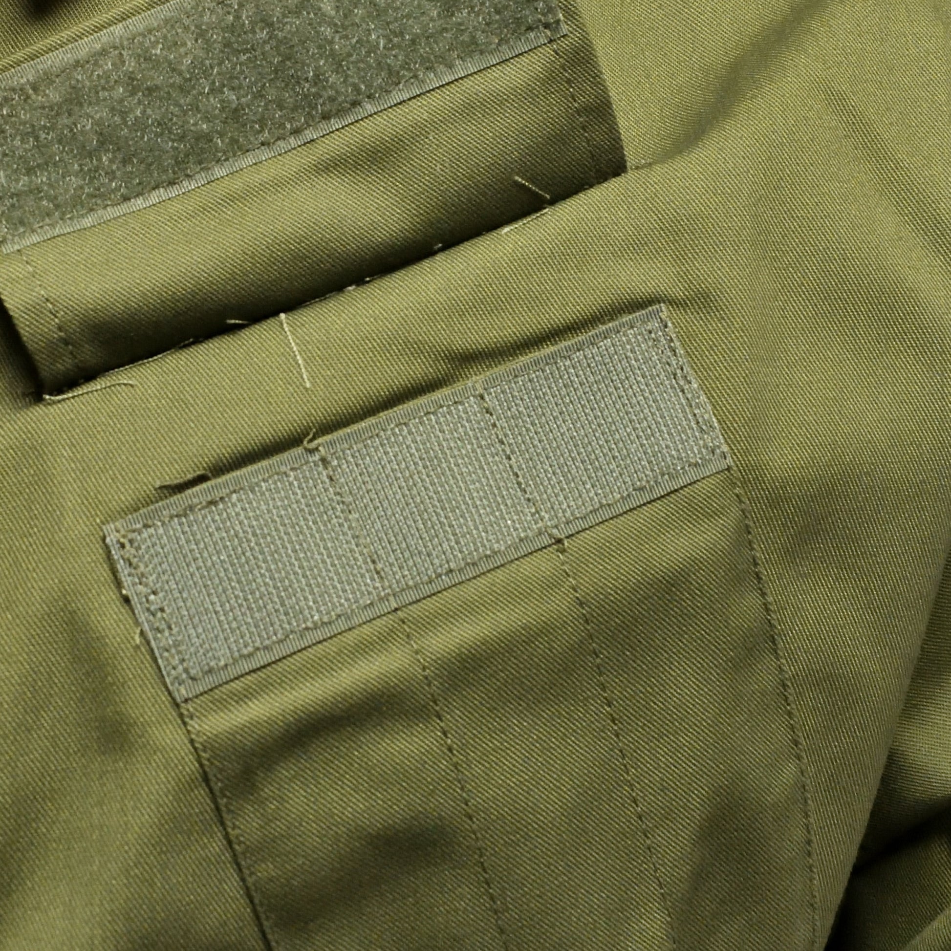 Close-up of cargo pocket and durable stitching on British Army Coveralls.