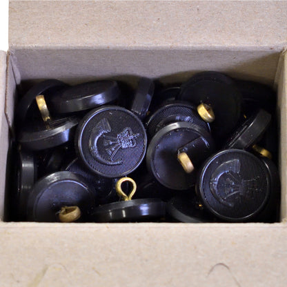 Top-down view of Firmin & Sons "The Rifles" black moulded buttons, box of 100.