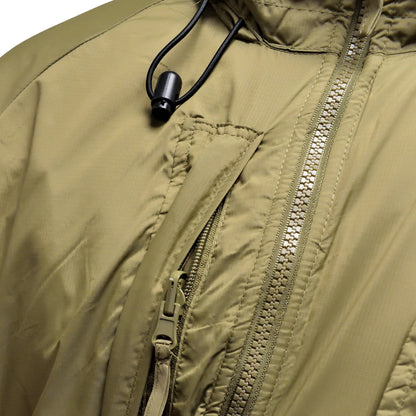 Close-up of zip and pocket details on British Army Thermal Jacket with Integral Stuff Bag in PCS Olive.