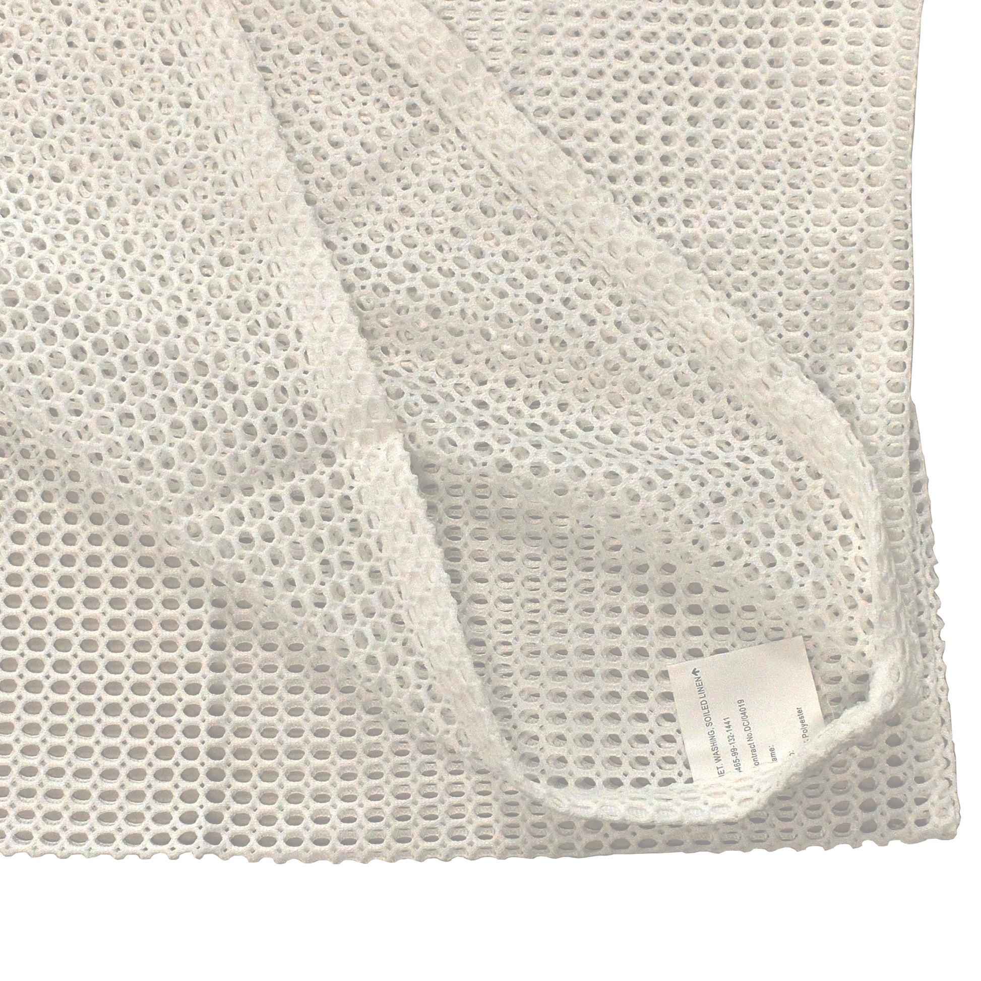 Close-up of stitching and mesh weave on white net bag for soiled linen.