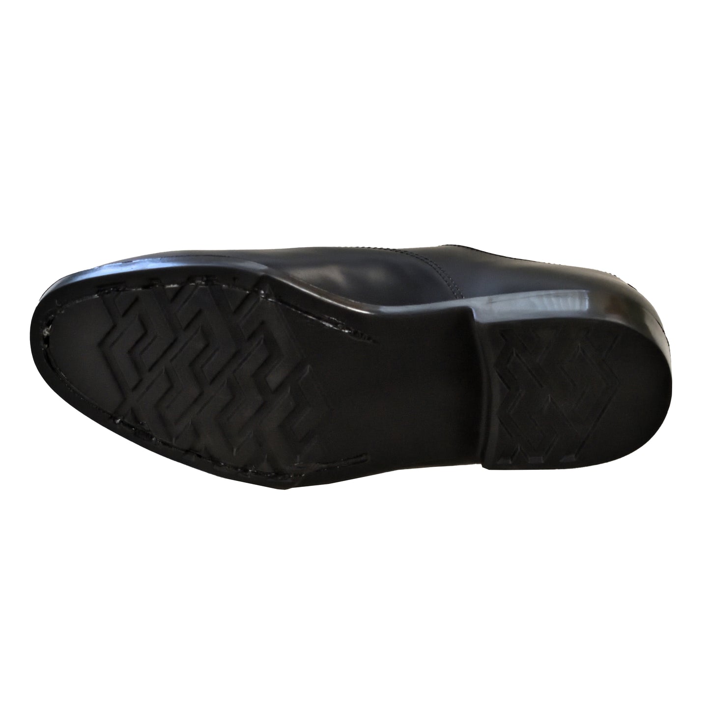 Sole detail of black service shoes showing grip pattern and stitching.