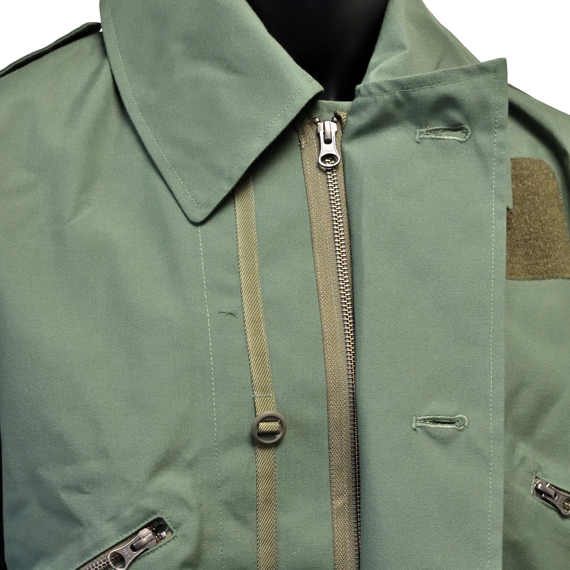 Close-up of front zip and chest pocket detail on FR Cold Weather Jacket MK4.